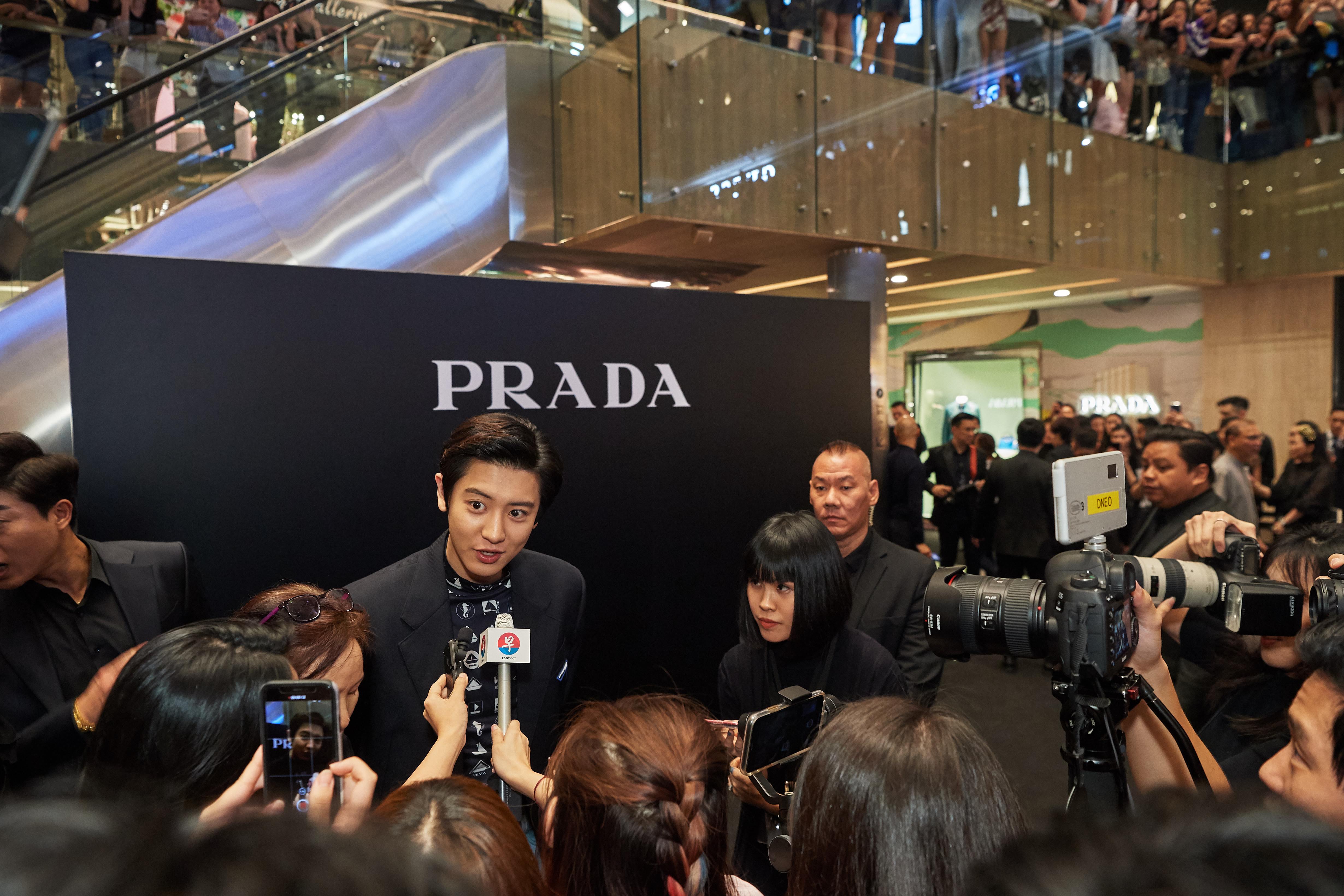 Event photographer in Singapore covering press conference with media scrum and brand signage